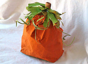 a pumpkin made from a painted paper bag