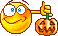a smilie posing with a jack-o-lantern
